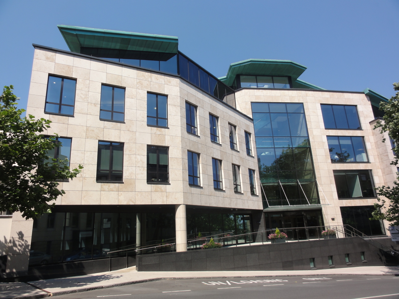 "Image of Royal Chambers - a modern looking building with grey stone and many windows"
