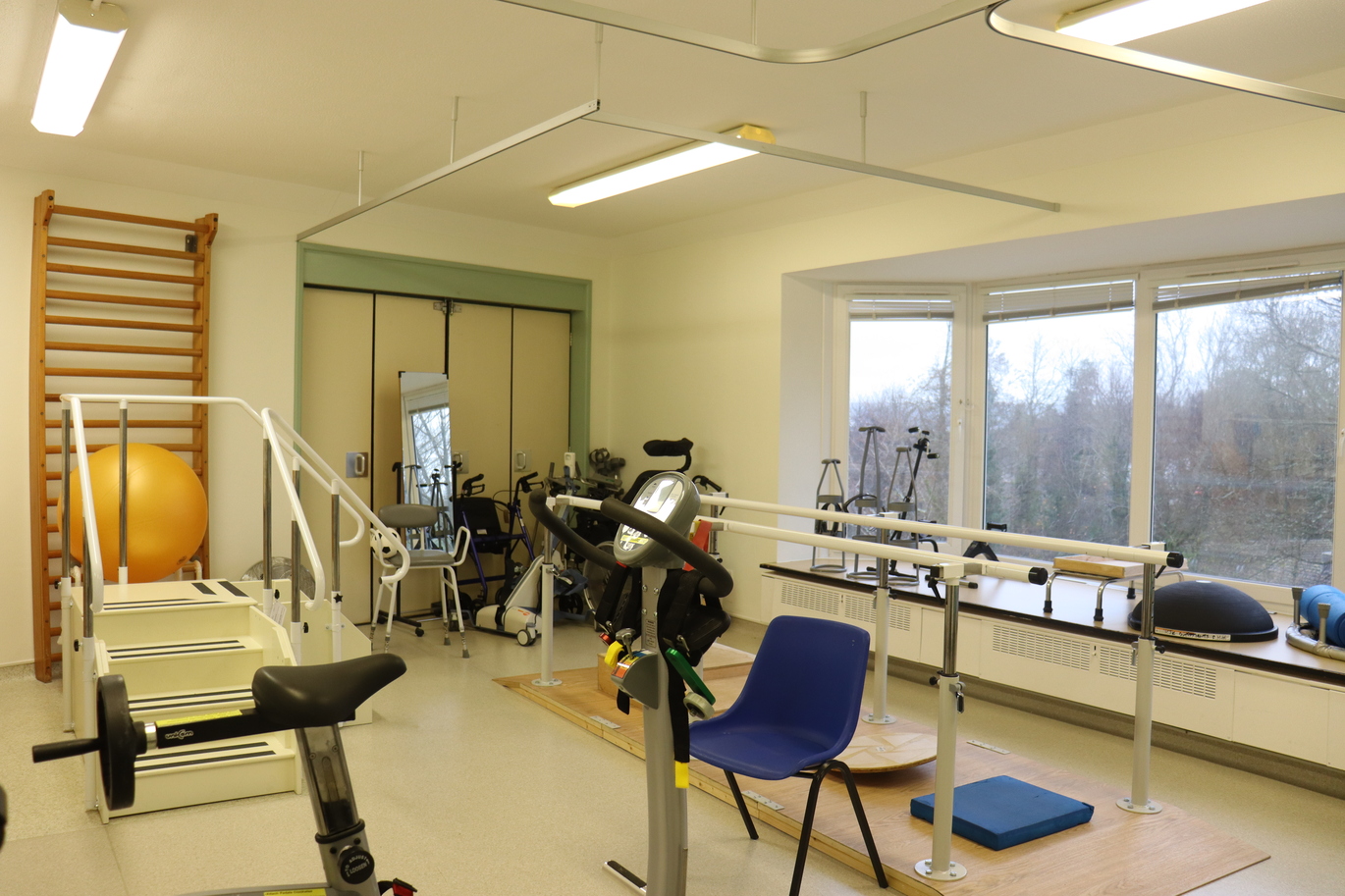 Gym area with exercise bike and walking frame