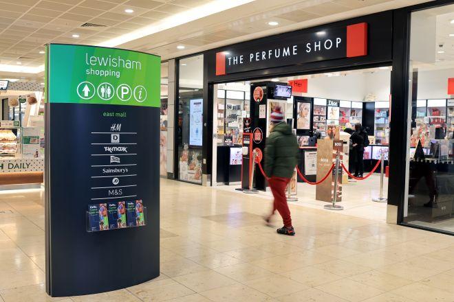 "Lewisham Shopping Centre sign with store directory beside The Perfume Shop entrance."