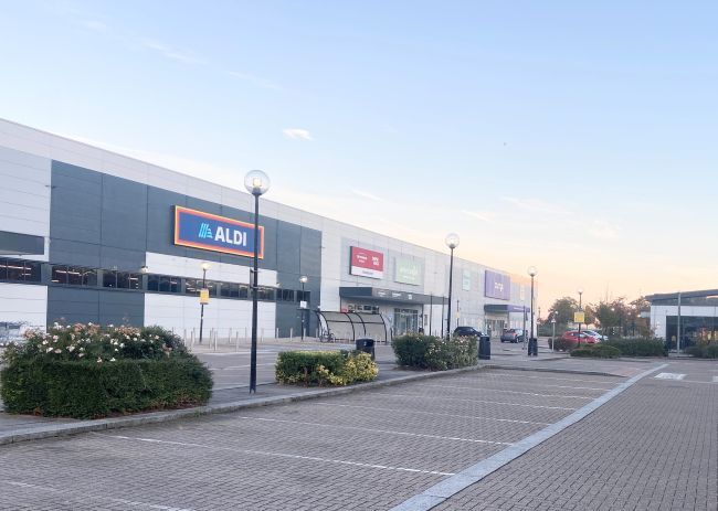 The Place, Aldi store in background