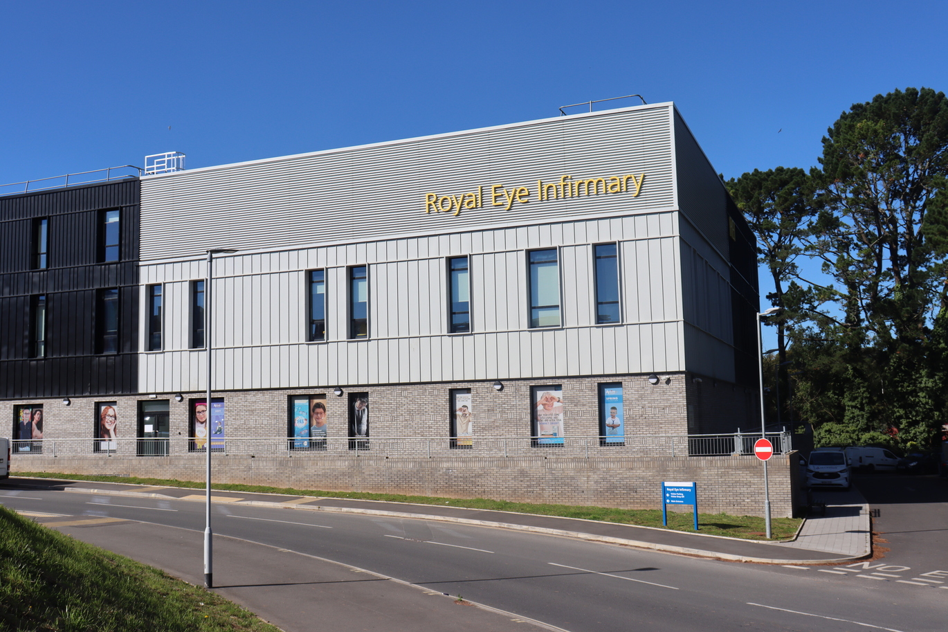 Grey building with road in front