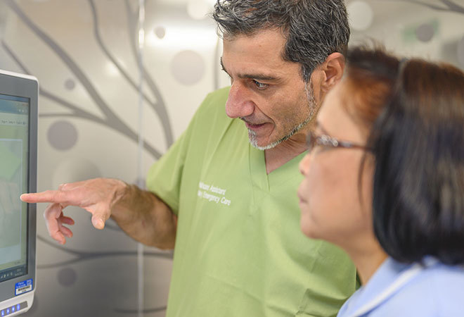 "Staff looking at screen"
