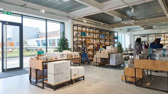 'fiskars store with products on display and customers browsing in the back ground'