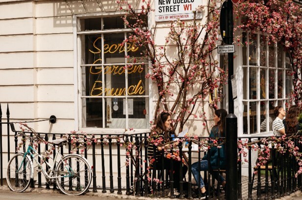 Daisy Green Street people having coffee on the sidewalk