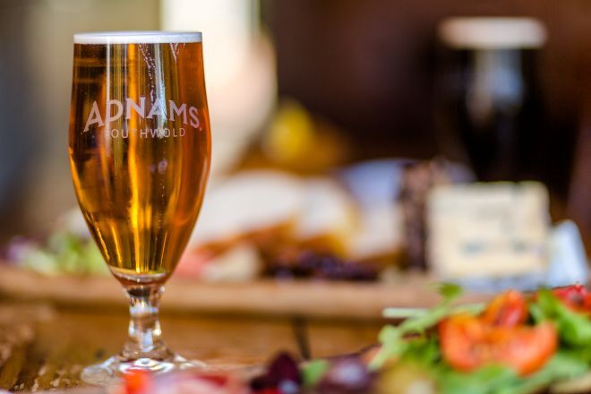 "Focus on an Adnams beer against a blurred background"