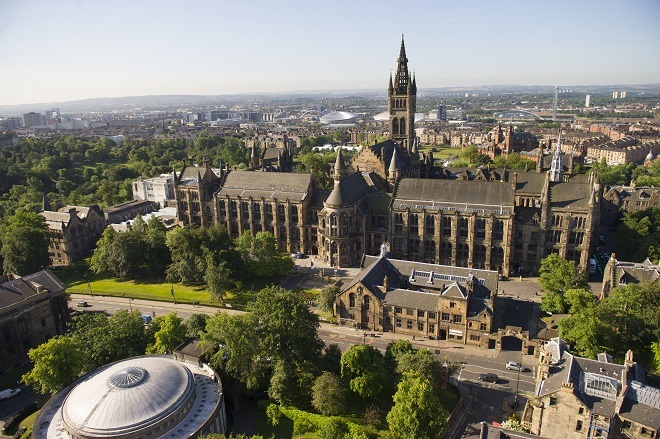 "University of Glasgow building aerial view with park land and other buildings surrounding"