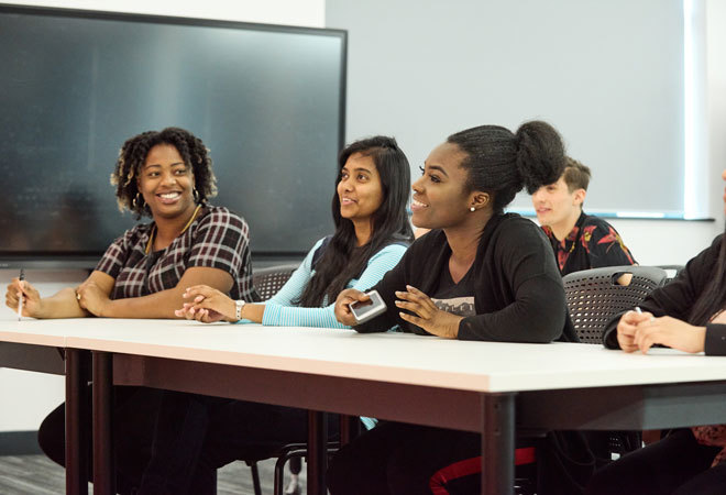 Image of 5 London met students sat at a table