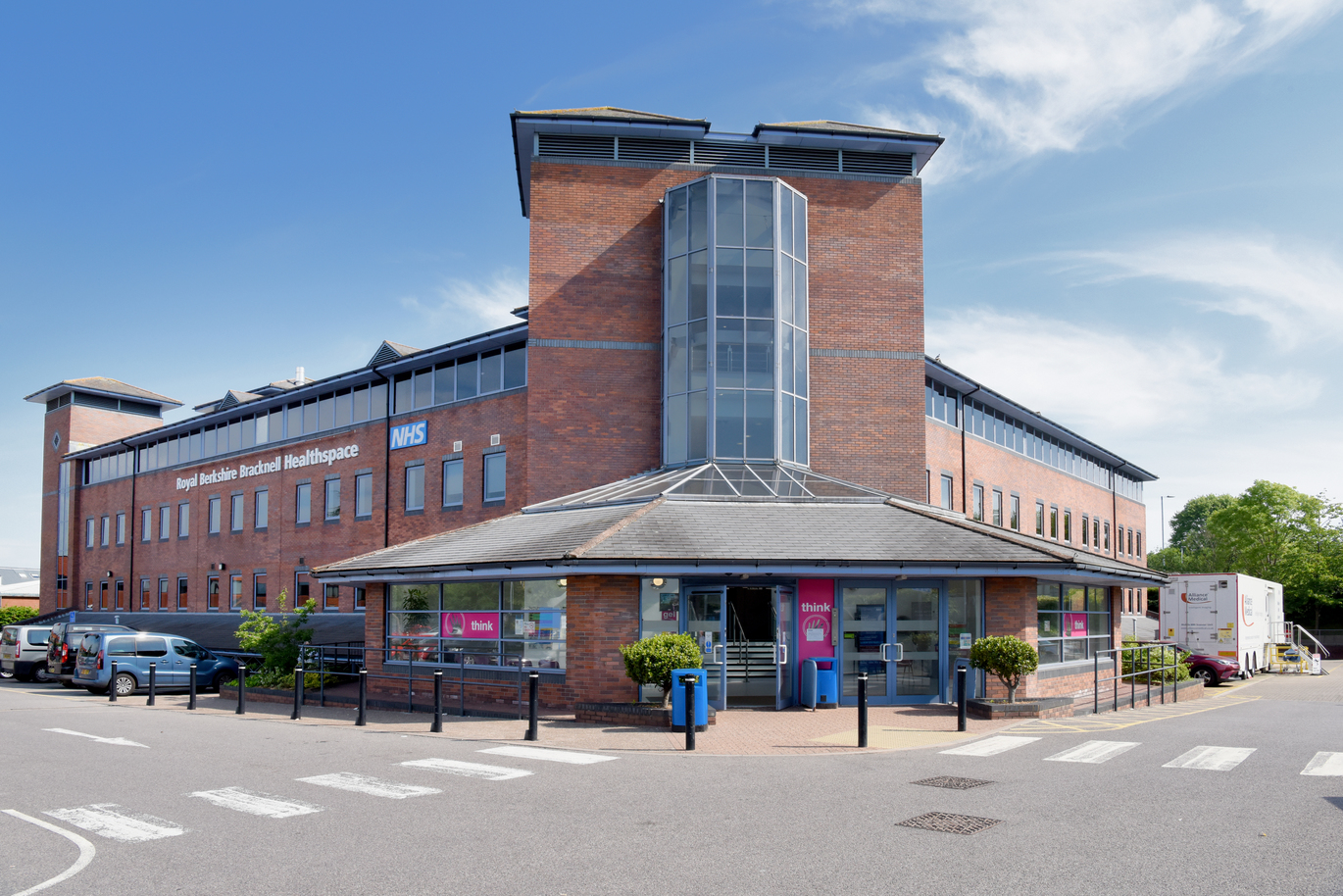 "Bracknell Healthspace brick building with blue sky in background"