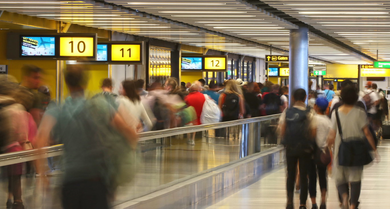"People queuing to check in at London Gatwick South Terminal"