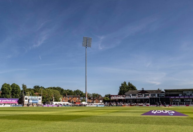 lush outfield, sunny day waiting for play to commence