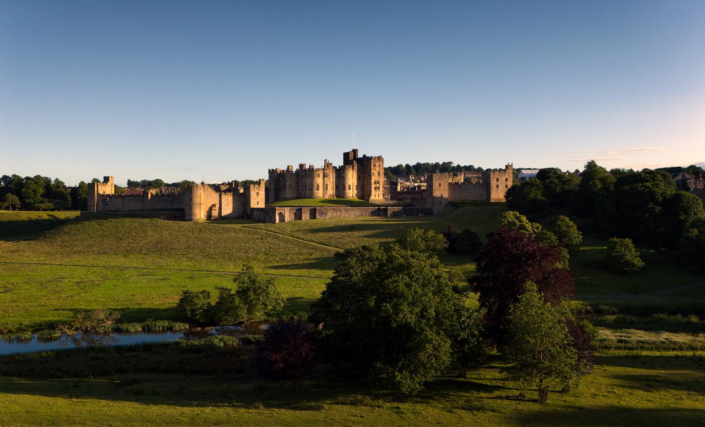  "A view of Alnwick Castle, Northumberland from across the Pastures designed by Capability Brown"