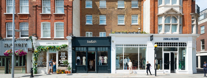 Photo of 4 shops on King's Road with people walking on the pavement
