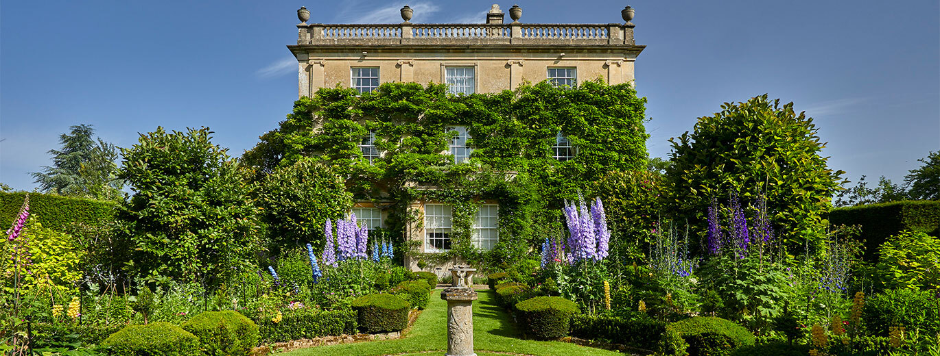 "Highgrove House and gardens with a backdrop of blue skies"