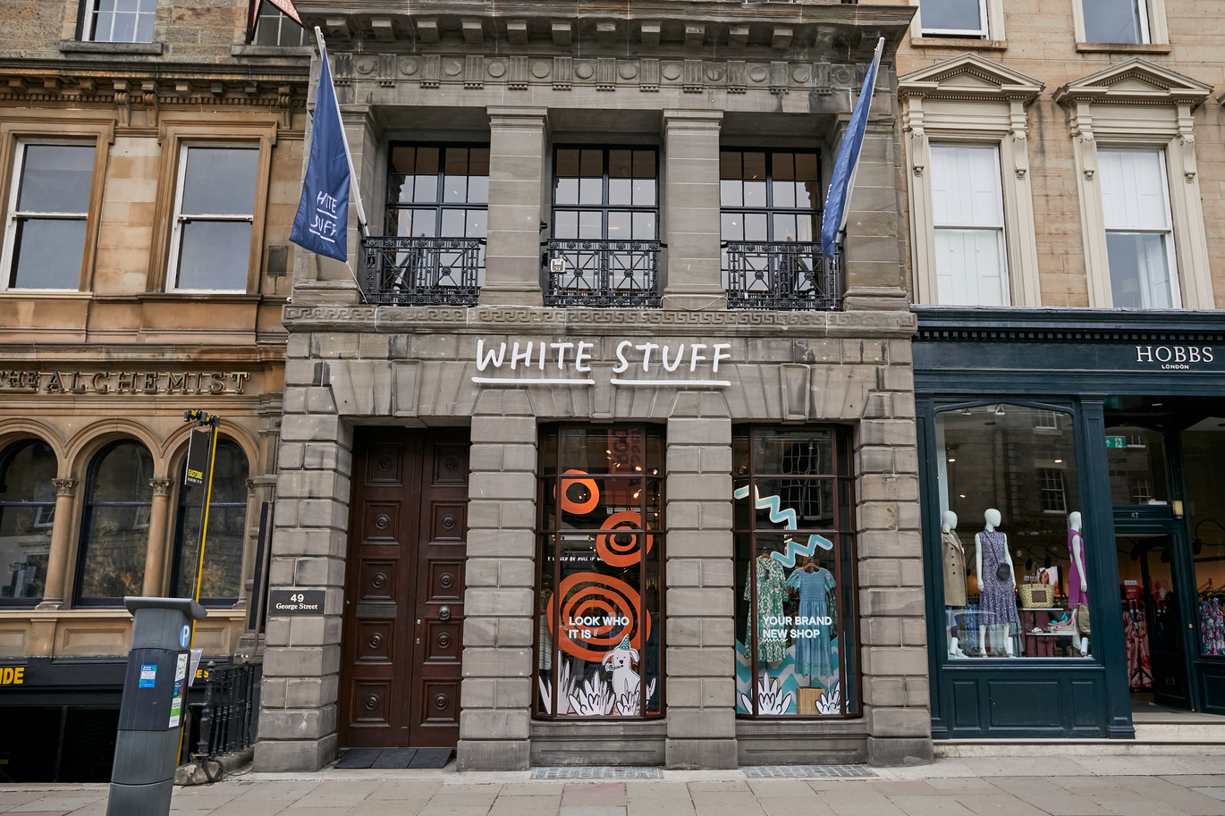 View of the front of the store in-between The Alchemist and Hobbs. 