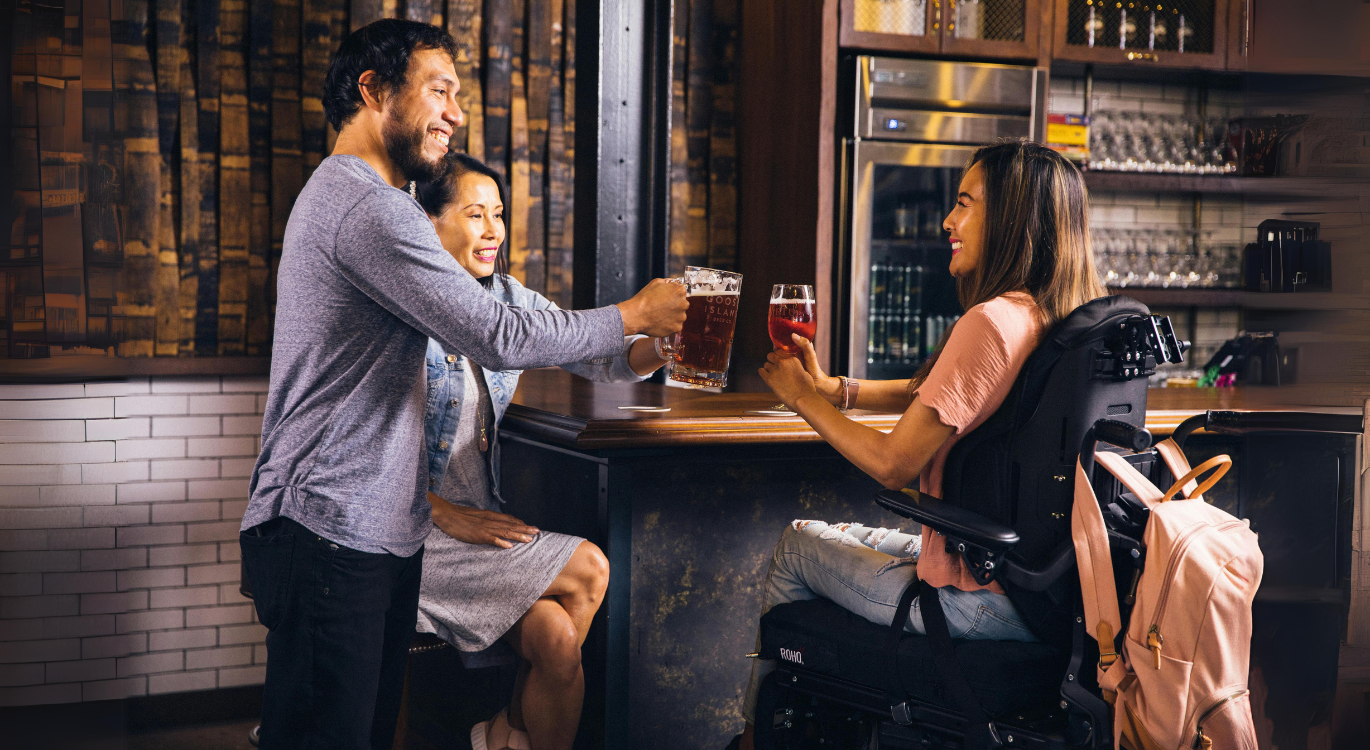 A group of people enjoying drinks at a bar