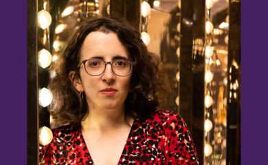 A white woman looks at the camera against a lightbulb background
