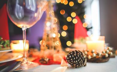Brown acorn near clear long stem wine glass