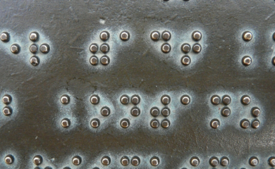 Braille on bronze plaque