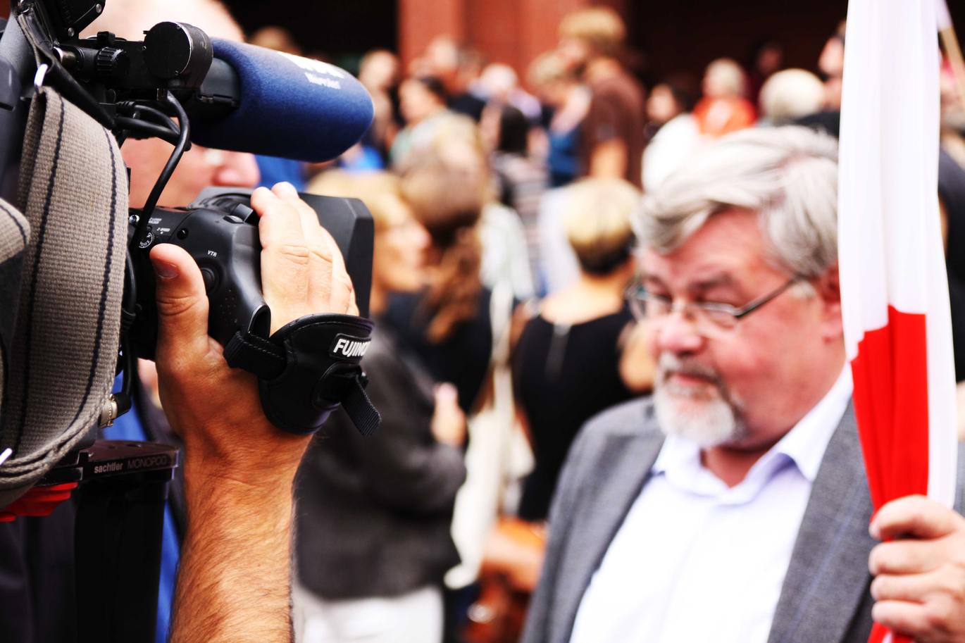 "man being filmed "